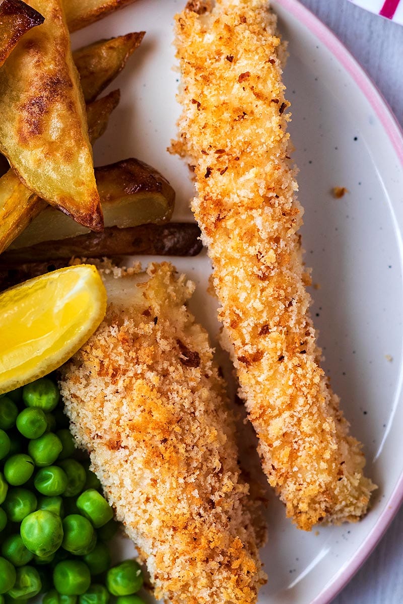 Two fish sticks on a plate.