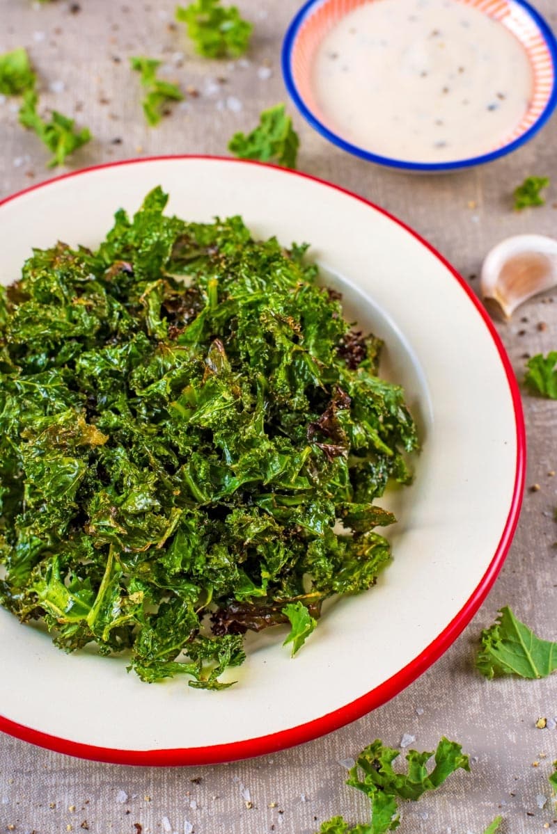 A white plate with Kale Chips.