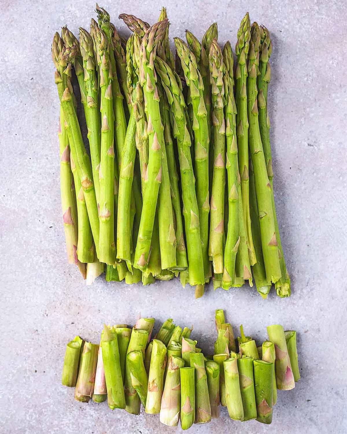 A bunch of asparagus spears with their woody ends trimmed.