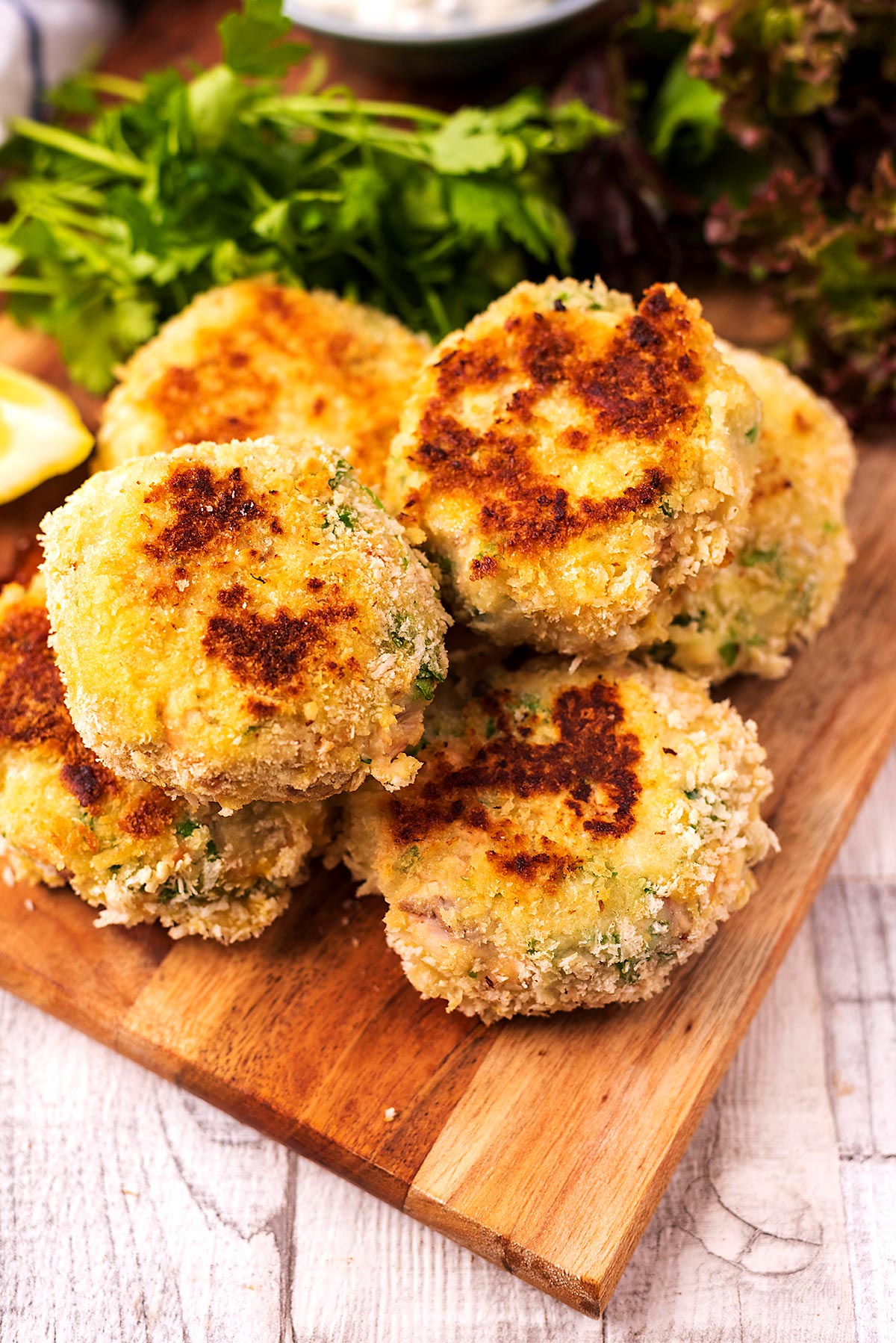 A pile of fish cakes on a serving board.