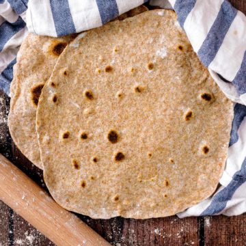 Whole Wheat Tortillas on a wooden surface.