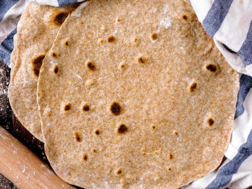 Whole Wheat Tortillas on a wooden surface.