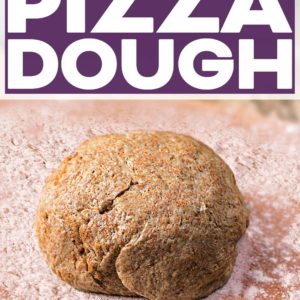 A ball of Wholewheat Pizza Dough on a floured surface with a text title overlay.