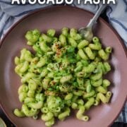 Creamy avocado pasta with a text overlay title.