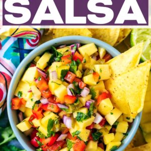 A bowl of mango salsa with a text title overlay.