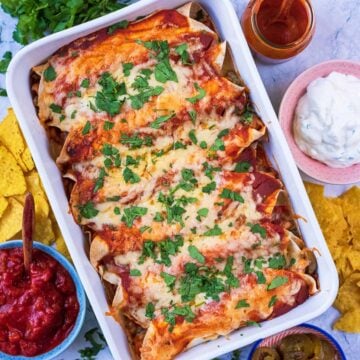 A baking dish containing Easy Chicken Enchiladas