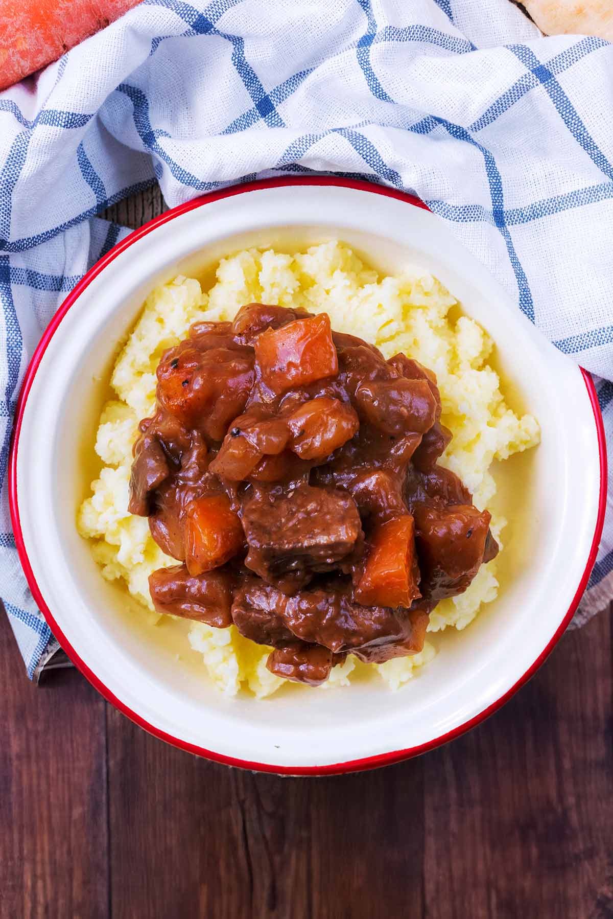 Beef casserole on top of mashed potatoes.