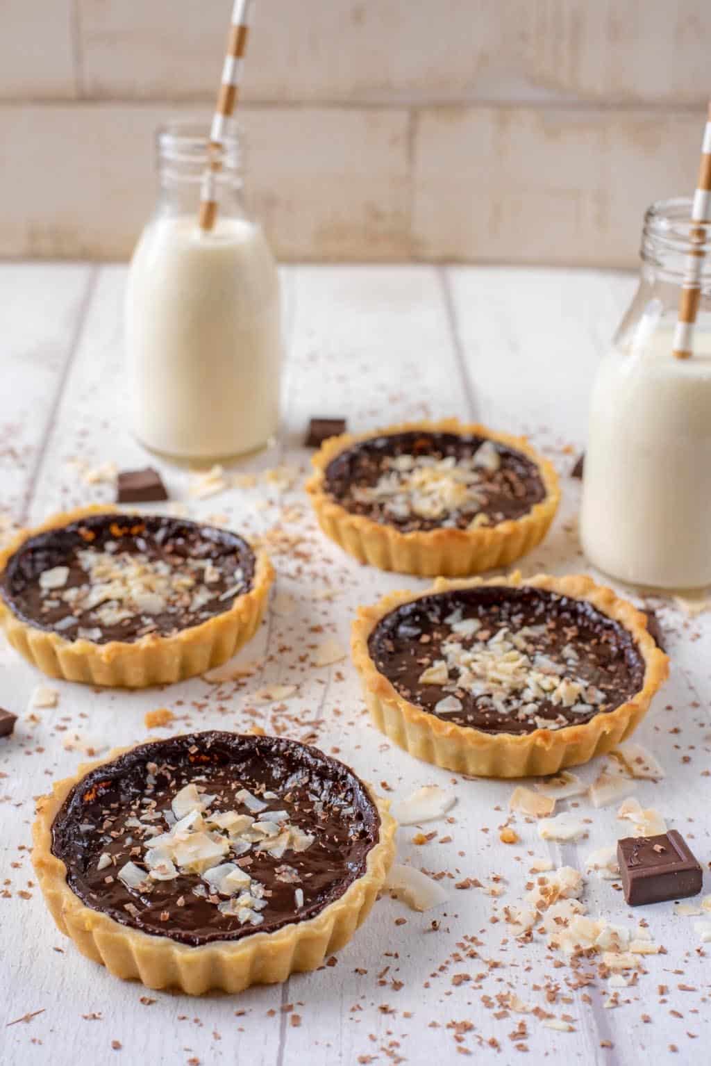 Four Chocolate Pies with two bottles of milk.