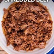 Slow cooker shredded beef with a text overlay title.
