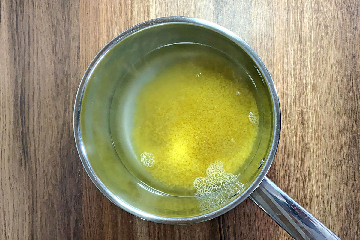 A saucepan with bulgar wheat cooking in it.