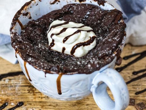 Healthy chocolate mug cake in front of a towel