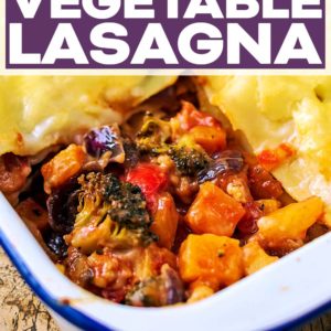 A pan of roasted vegetable lasagna with a text title overlay.
