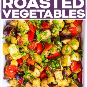 A baking tray full of Italian Roasted Vegetables with a text title overlay.
