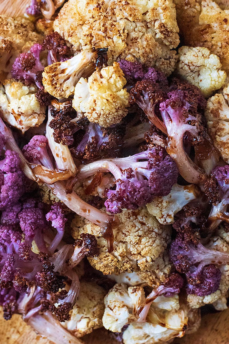 White and purple roasted cauliflower in balsamic vinegar dressing.