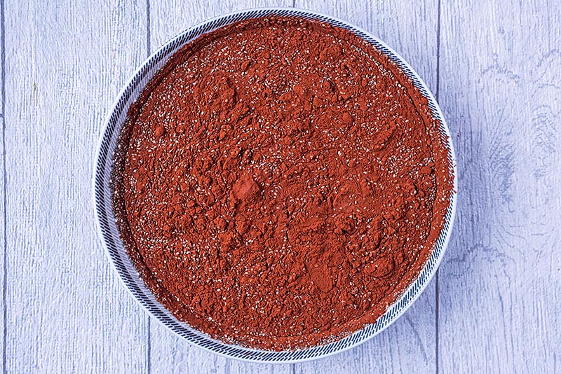 Unmixed chocolate pudding in a large dish.