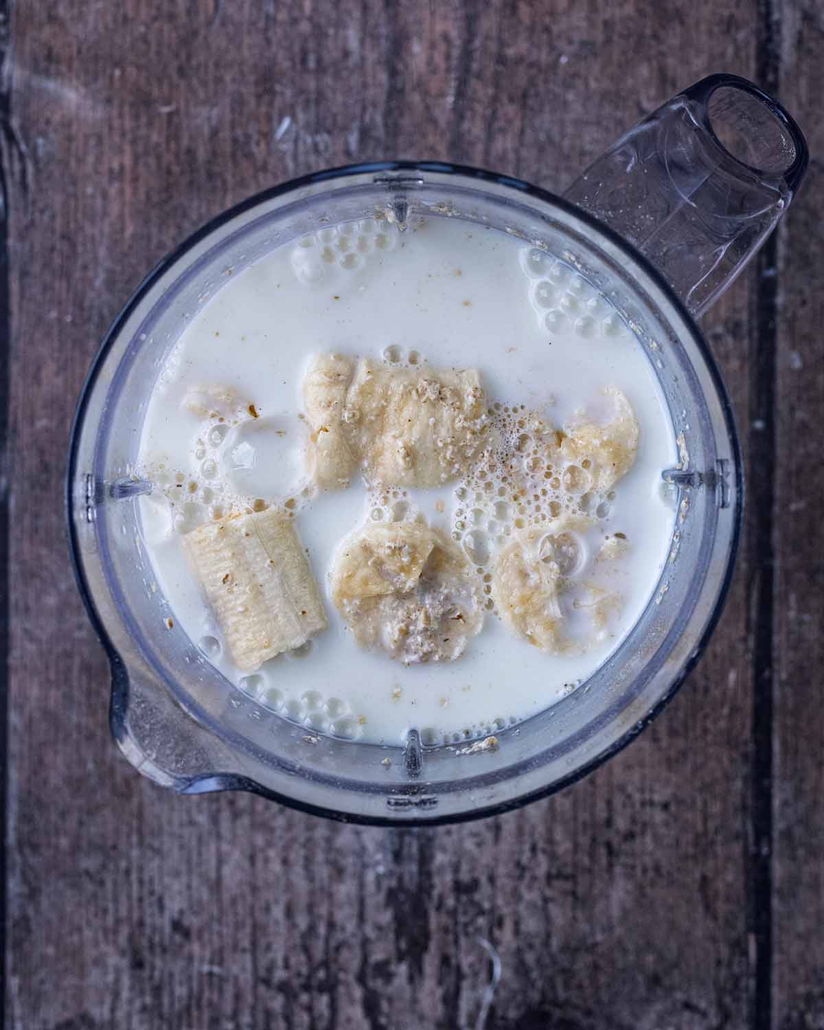 Milk and banana added to the blender.