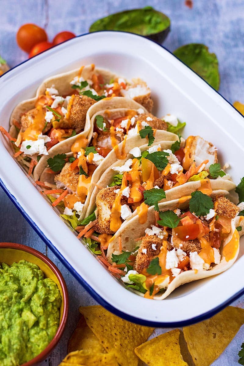 A serving dish full of Fish Tacos.