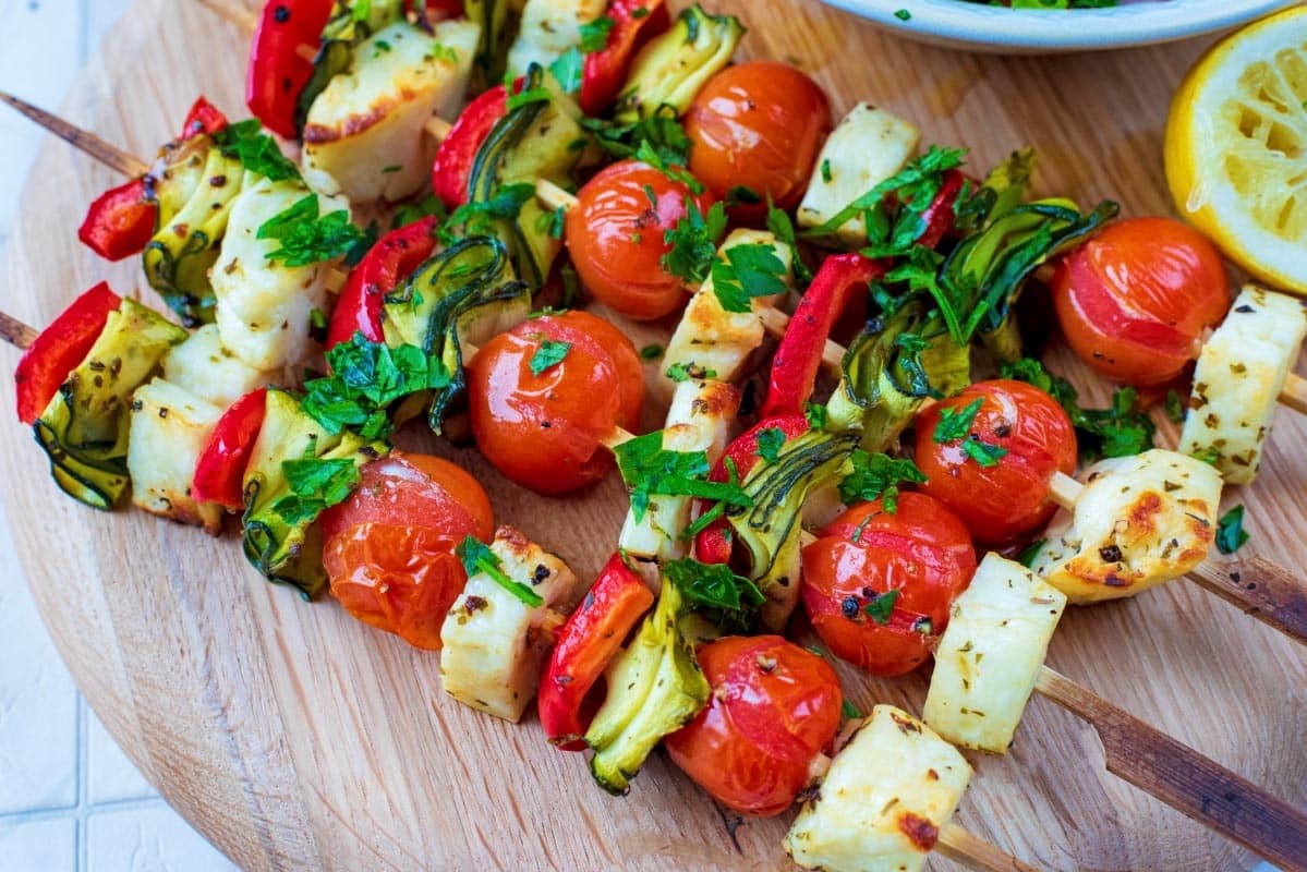 Vegetable and Halloumi Kebabs on a circular serving board.