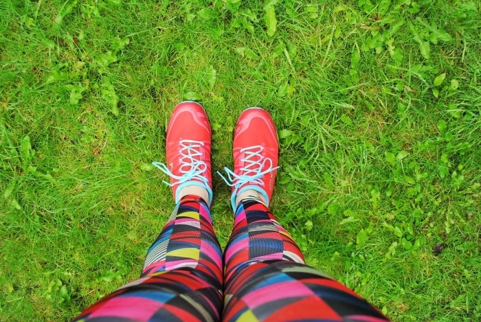 Red trainers on green grass