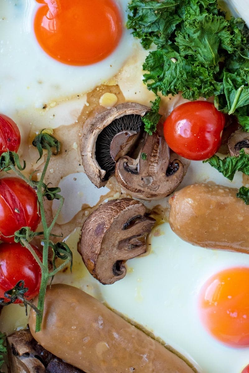 Mushrooms, eggs, sausages, tomatoes and kale.