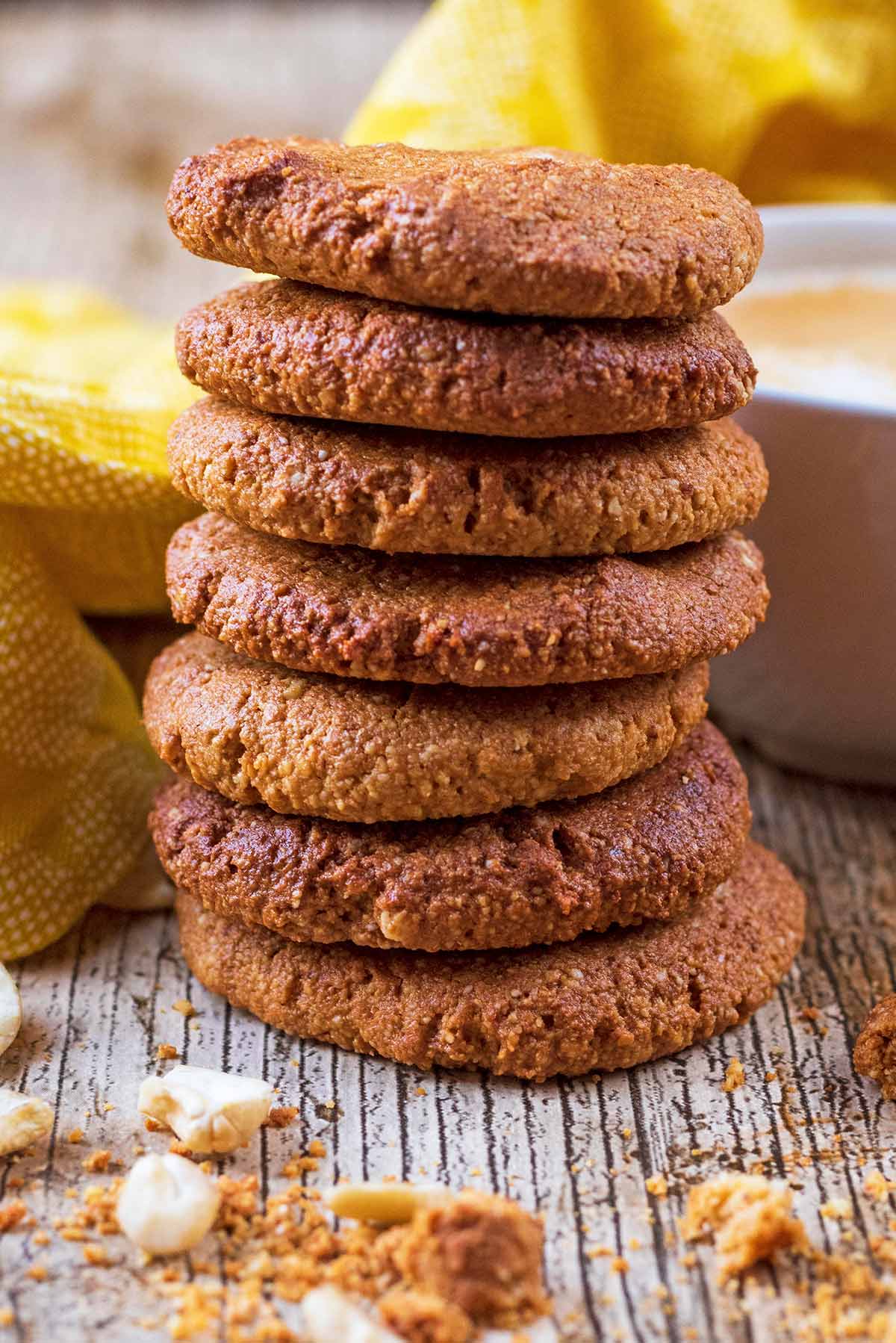 Seven gingernut biscuits stacked in a tower.