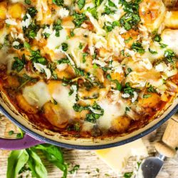 Spinach and Tomato Gnocchi Bake in a shallow baking dish.