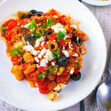 A white plate with a portion of Shakshuka