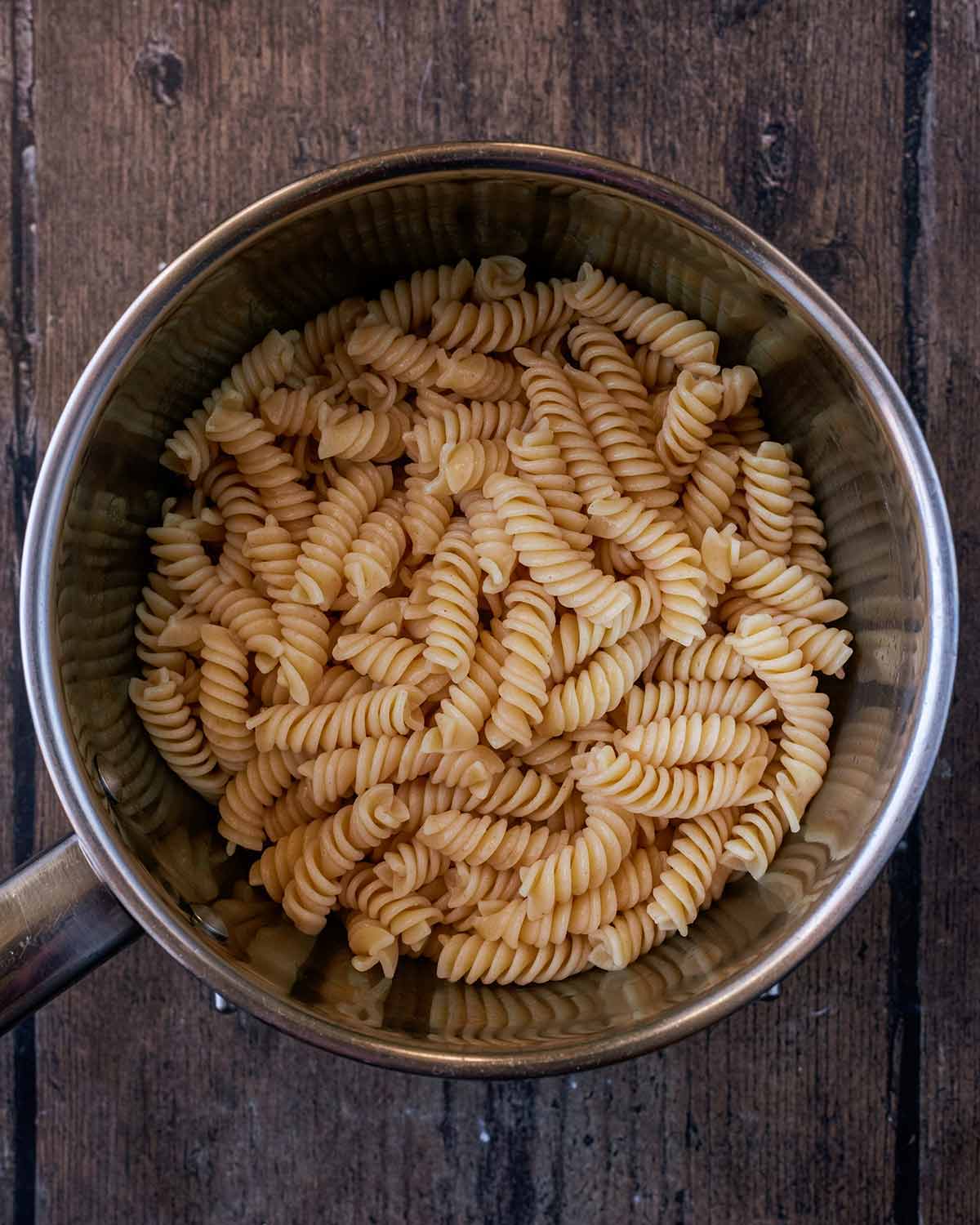 A pan of cooked fusilli pasta.
