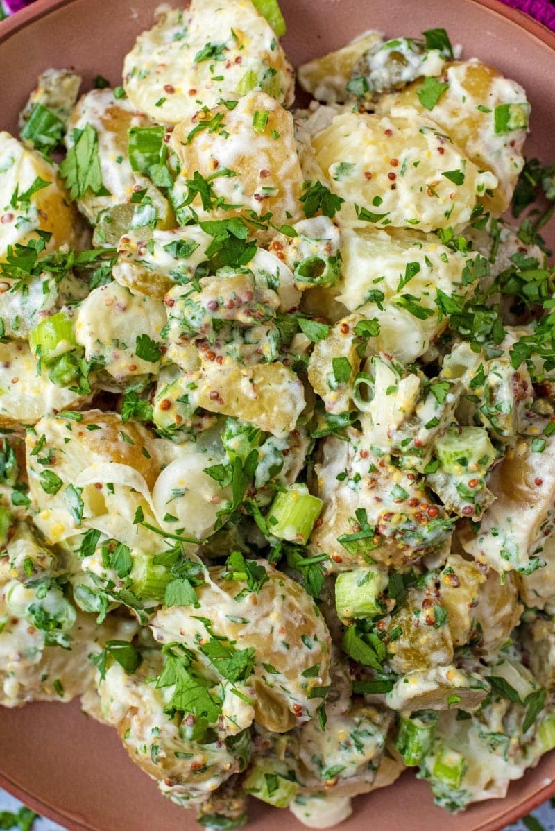 Potato salad with green onions and herbs.
