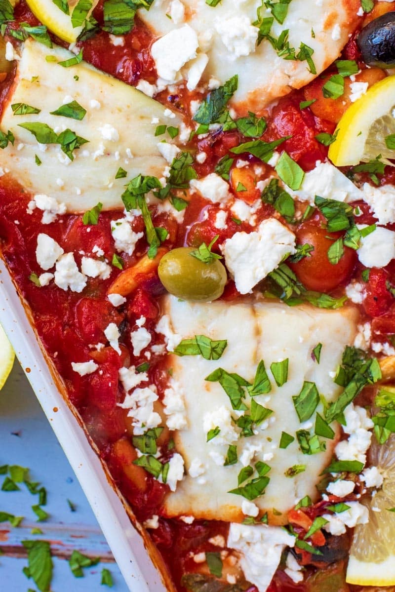 Cod in tomato sauce with olives and feta cheese.