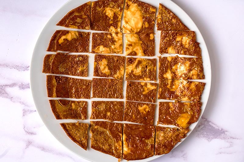 A thin omelette sliced into rectangles.