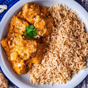 A plate of chicken korma and rice