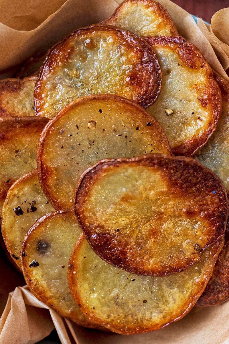 Homemade potato chips piled up.