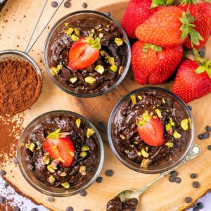 Chocolate avocado pudding in serving glasses.