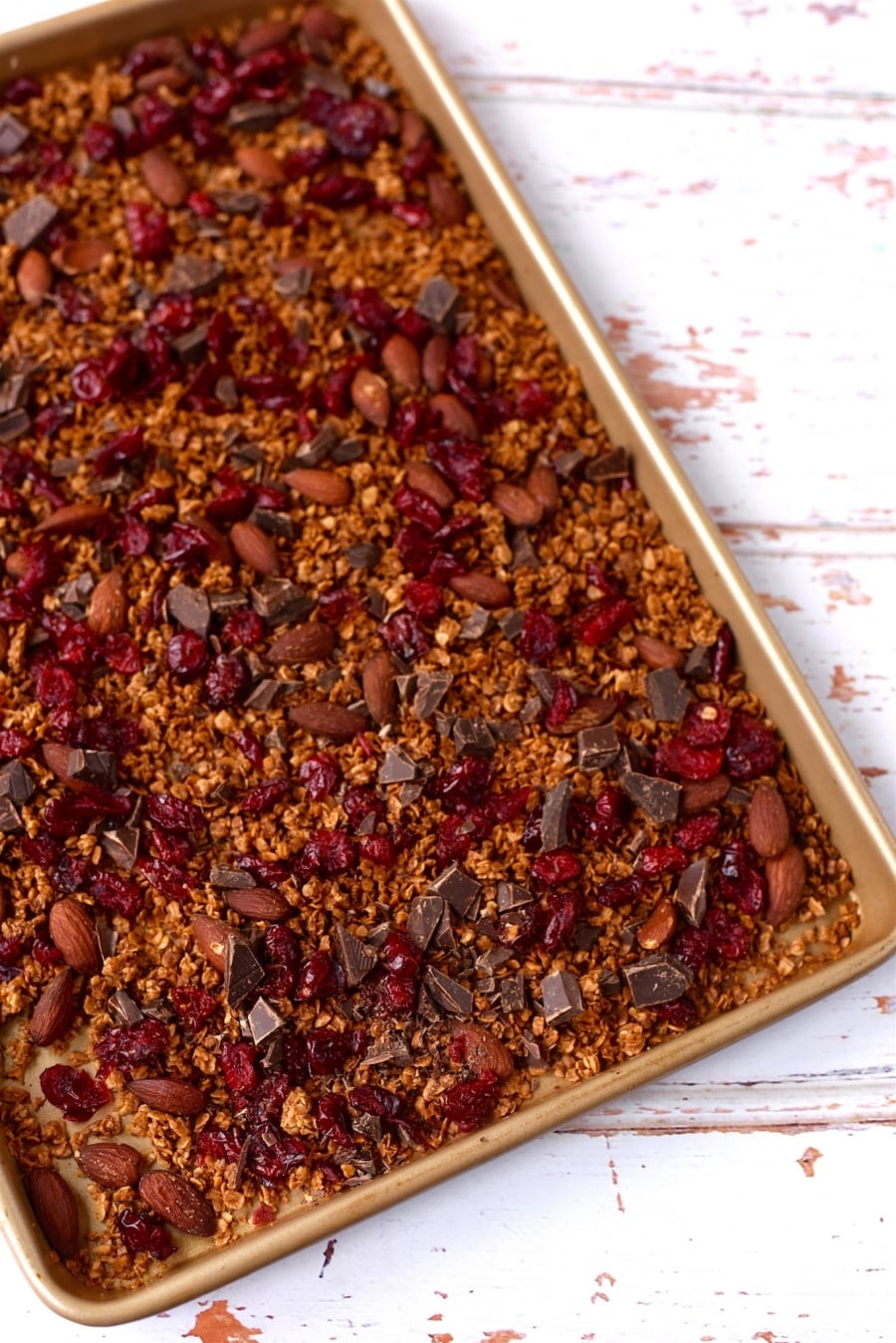 A large baking tray full of cooked granola.