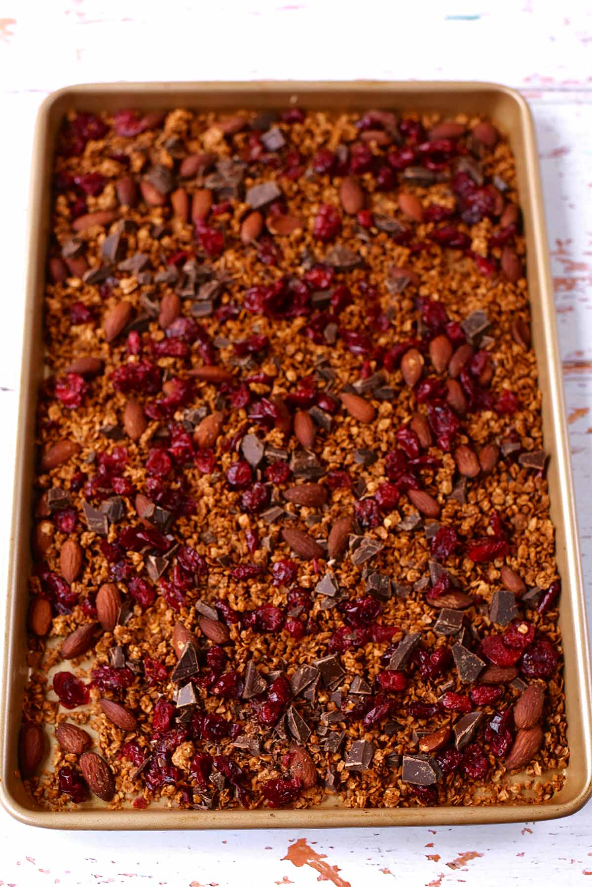 A large baking tray full of cooked granola.