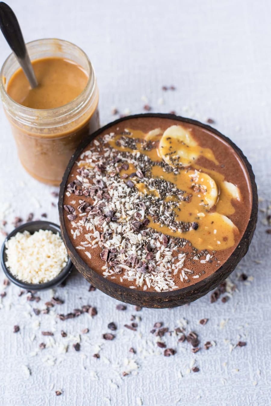 Chocolate Smoothie Bowl next to a jar of peanut butter.