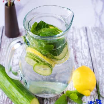 A jug of sparkling cucumber water.