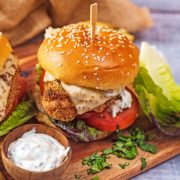 Baked chicken burger in a brioche bun with lettuce and tomato