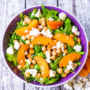 A bowl of feta and chickpea salad with apricots.