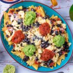 Breakfast Nachos on a large blue plate.