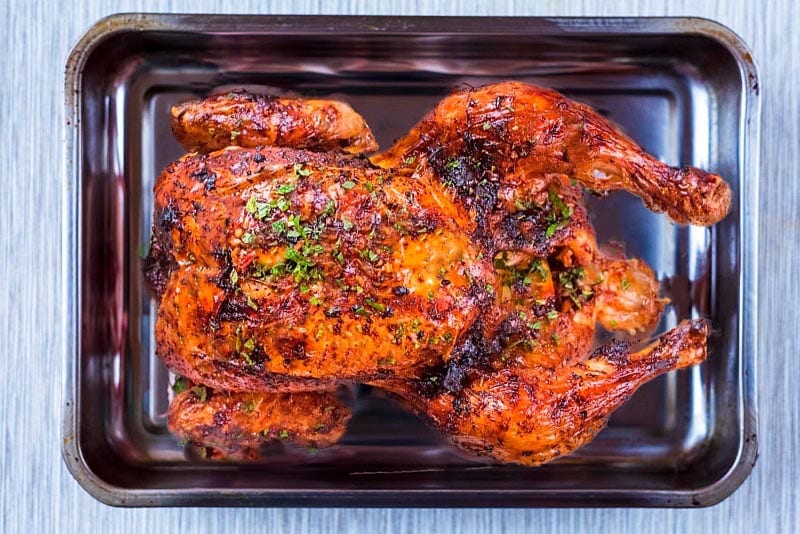 Roasted Harissa Chicken in a roasting tin.