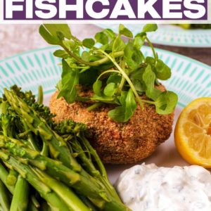 Tuna fishcakes and asparagus on a plate with a text title overlay.