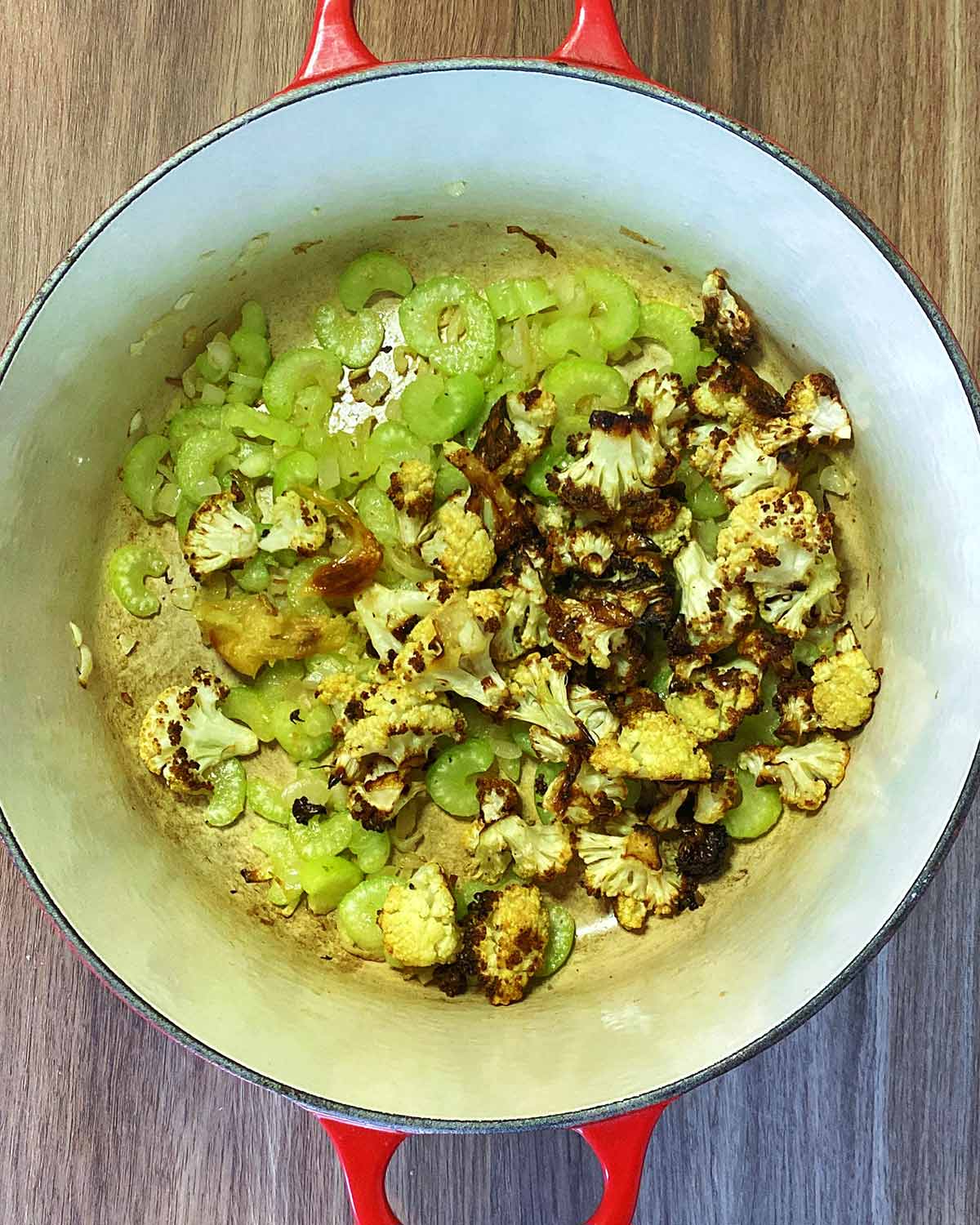 Roasted cauliflower added to the pan.