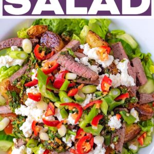 Steak salad in a large bowl with a text title overlay.