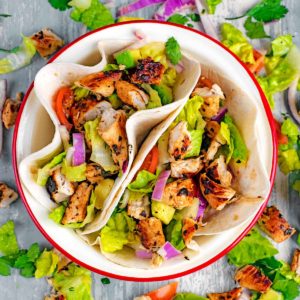 Two Grilled Chicken Tacos in a serving bowl.