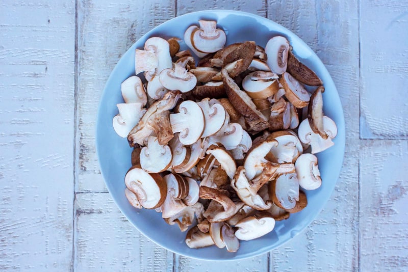 A plate full of sliced mushrooms.