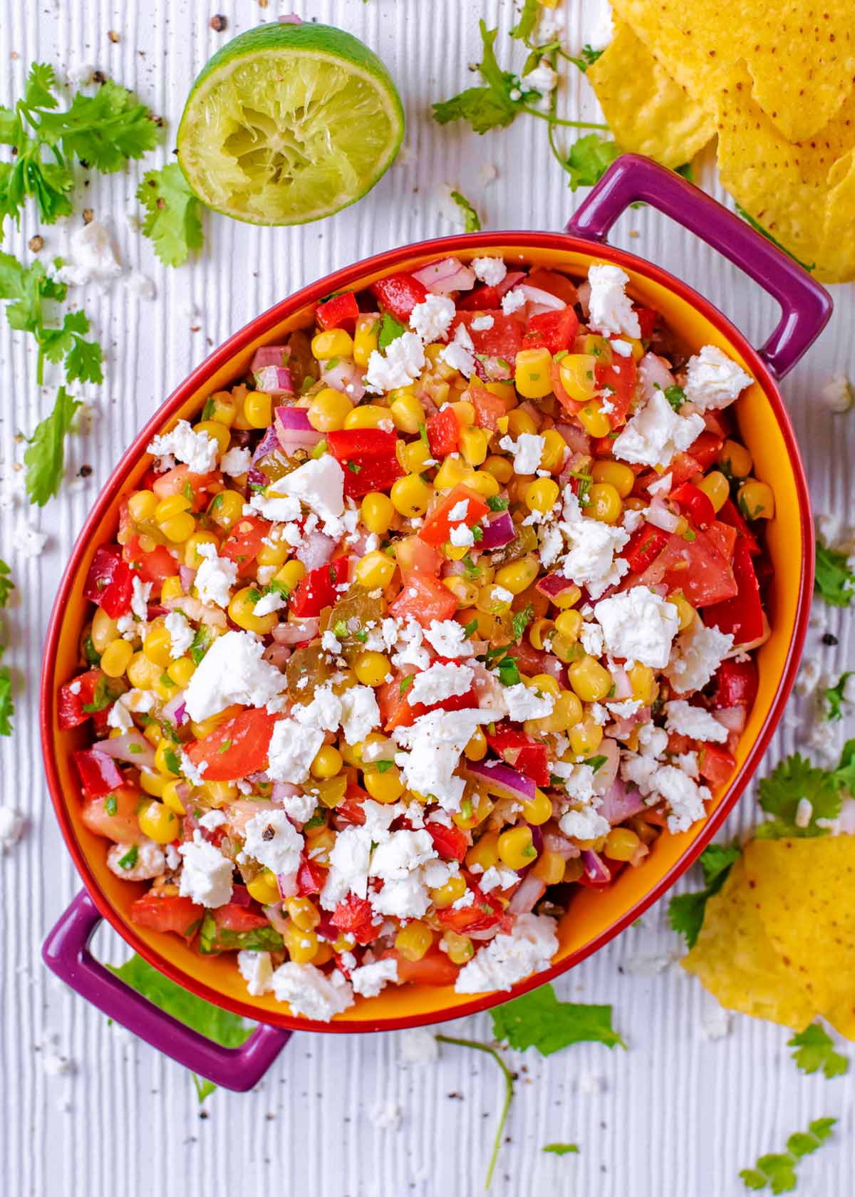 Sweetcorn Salsa in an oval dish topped with crumbled feta.