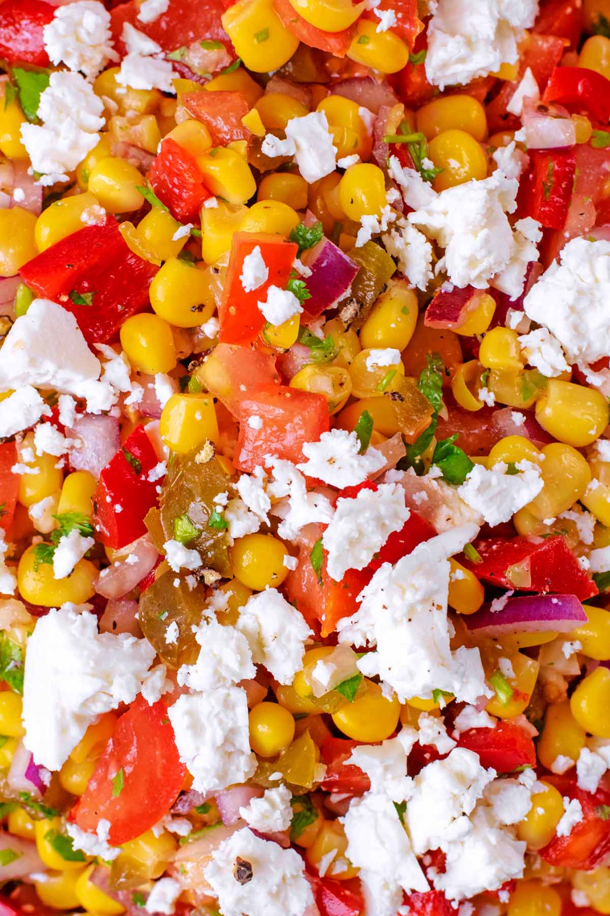 Sweetcorn, chopped peppers and tomatoes, herbs and feta.