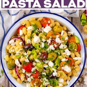 A bowl of Greek Pasta Salad with a text title overlay.